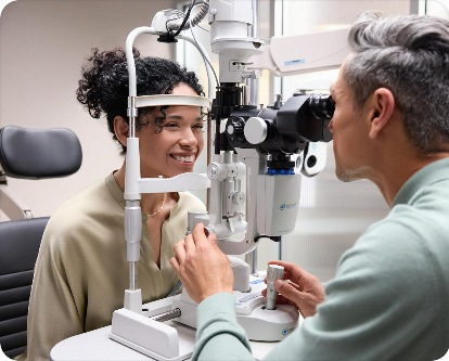 Patient receiving an eye examination with optometric equipment